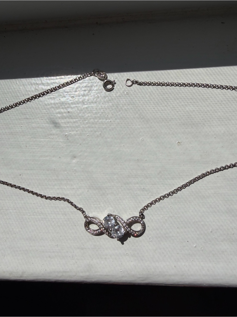 Delicate Silver Infinity Necklace with Clear Crystal Center